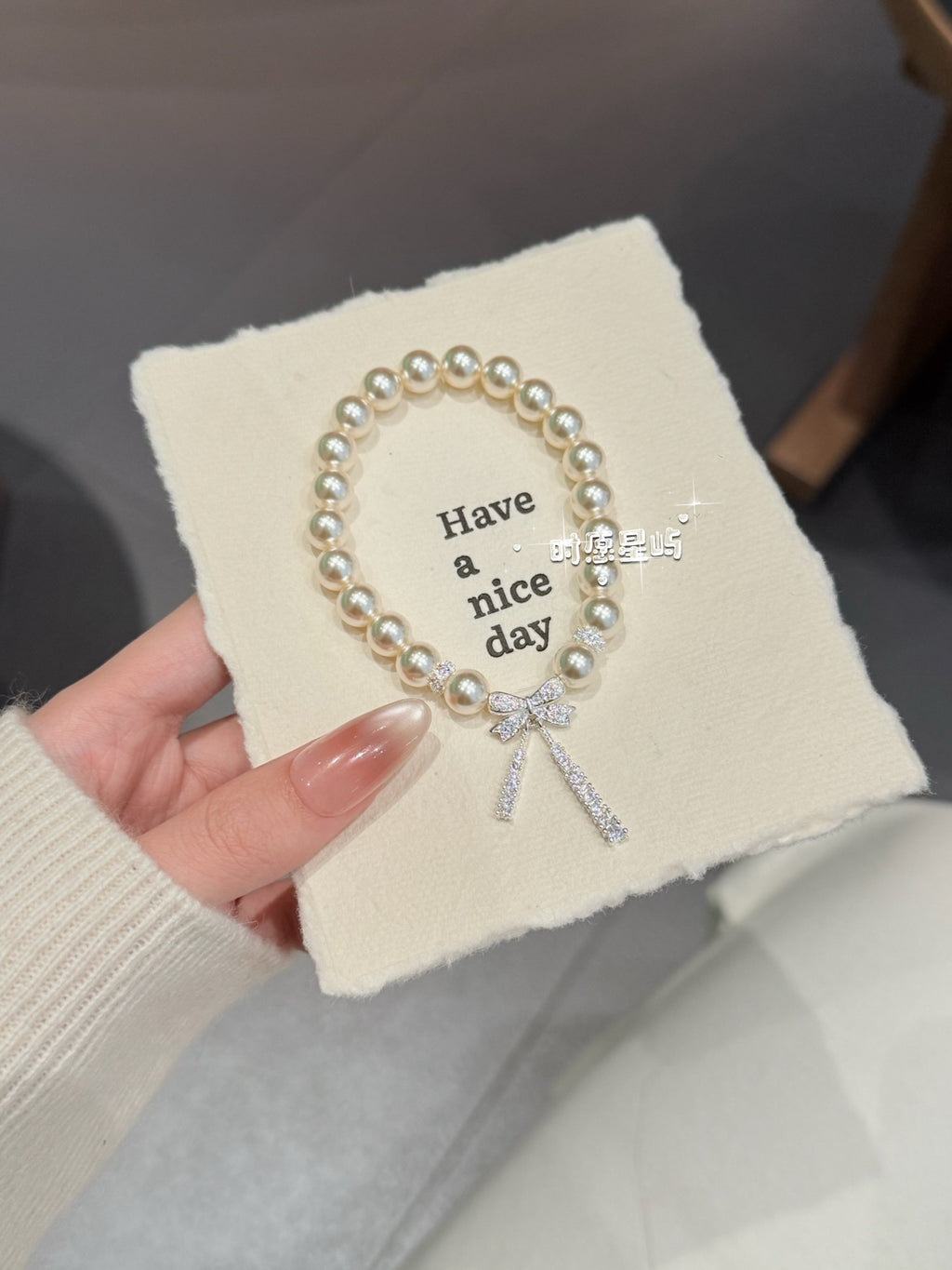 "Stellar Ribbon" Pearl Bracelet - S925 Silver Crystal Bow-Knot Charm for Romance, Elegance & Inner Youth
