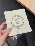 "Milky Way Star" Pearl Bracelet - S925 Silver Safety Pin & Pavé Cross Charms for Elegance, Protection & Radiant Glow