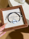 "Lunar Eye" Deep Blue Cat’s-Eye Peace Disc Bracelet - Hand-Woven Black Cord for Protection, Serenity & Cool-Toned Elegance